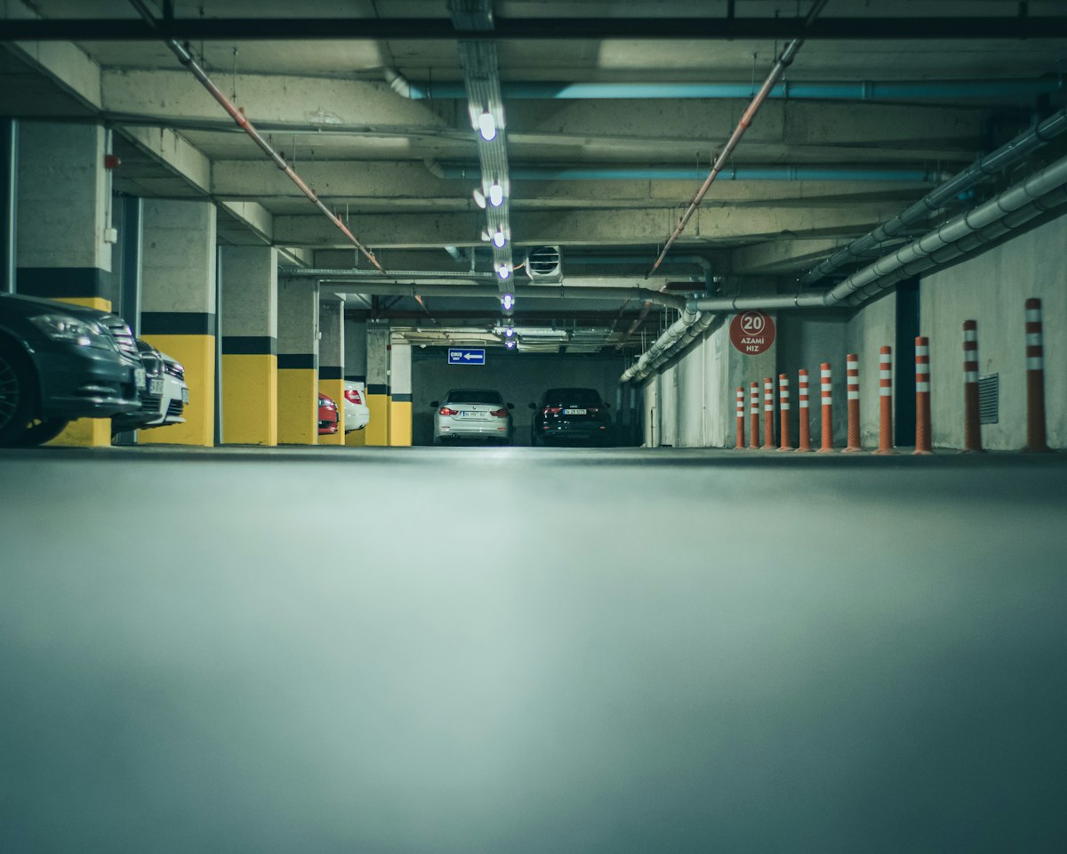 a parking garage with cars parked in it